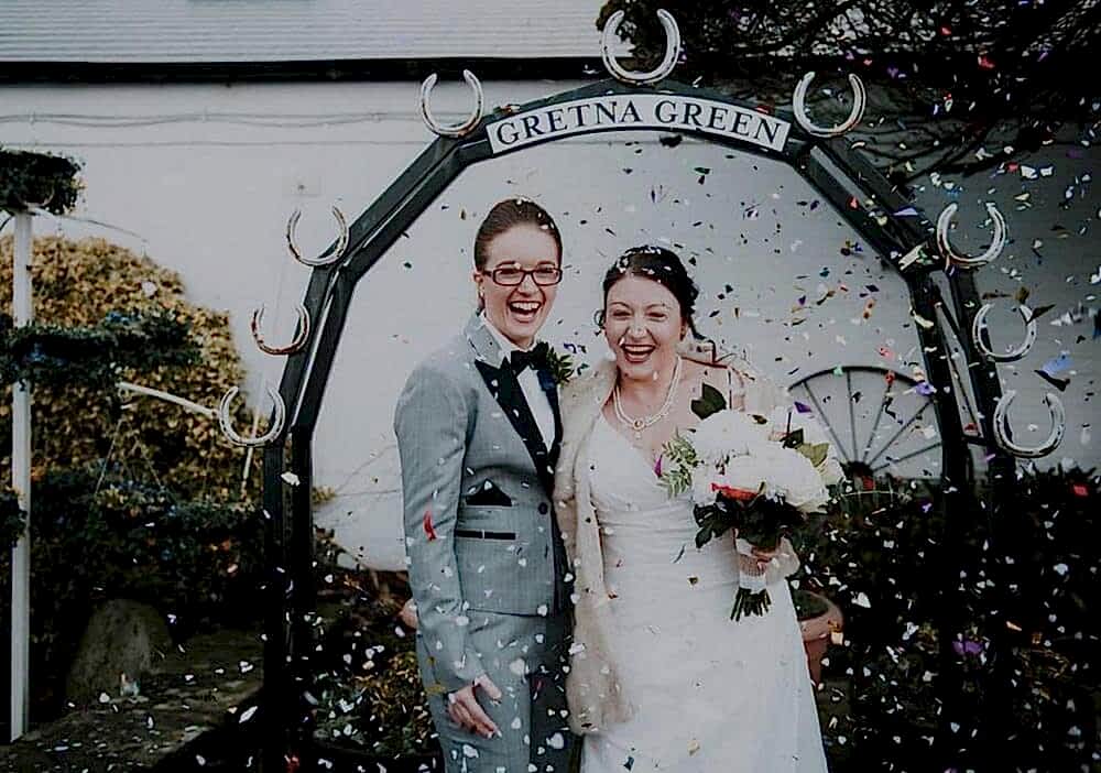 Wedding photo at the Kissing Gate Arch in Gretna Green
